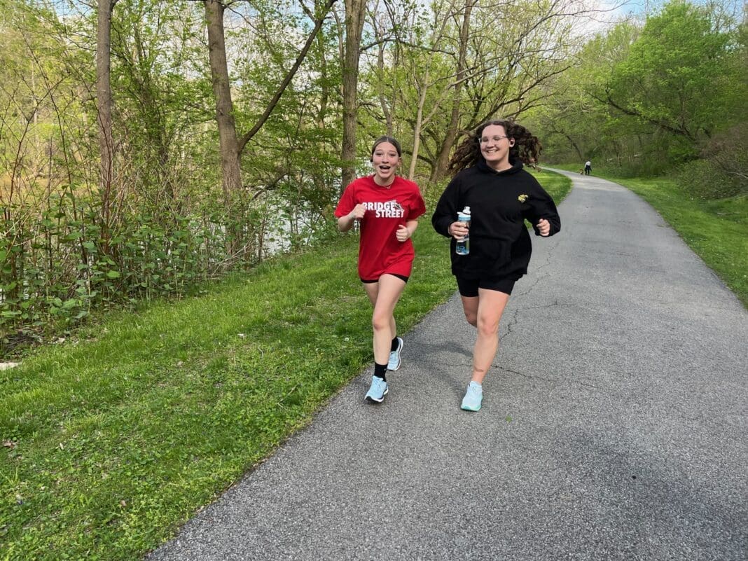 A couple of running kids.