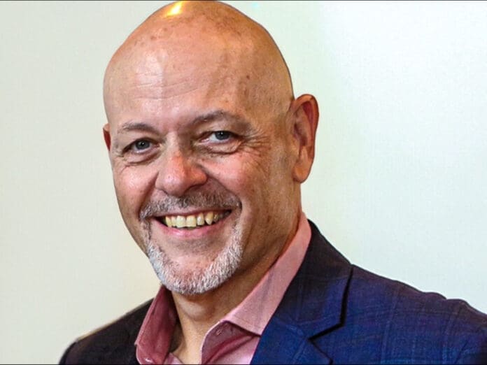 Screenshot A smiling man.