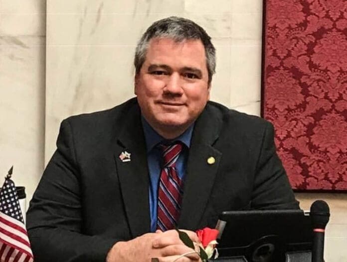 Screenshot A man grinning.