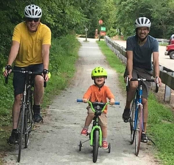 Three people on bikes.