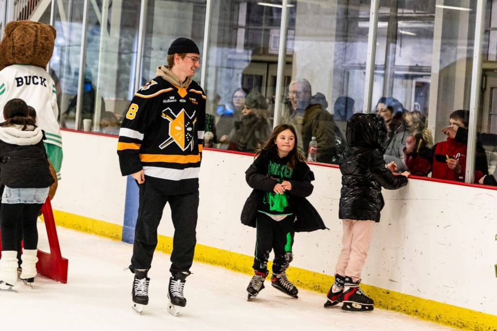 A hockey player with kids.