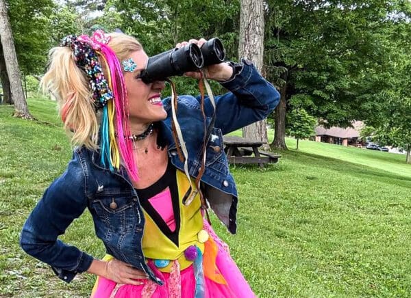 A lady with binoculars.