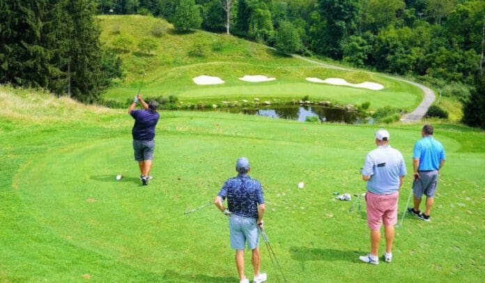 Following through on Hole 13 A green course.