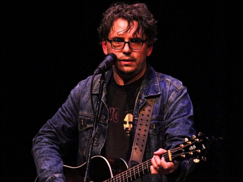 A man with a guitar.