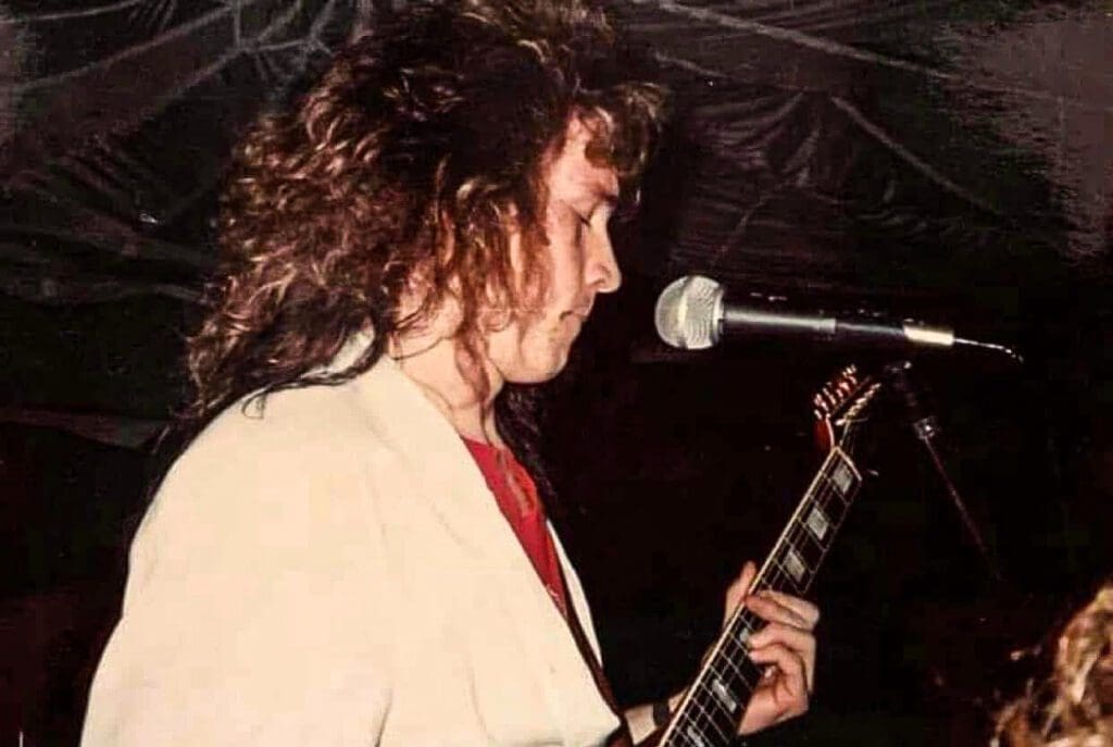 A man playing guitar.