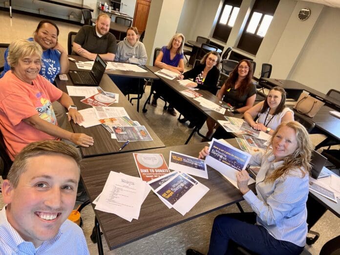 Wheeling Sleepout Volunteer A group of people.