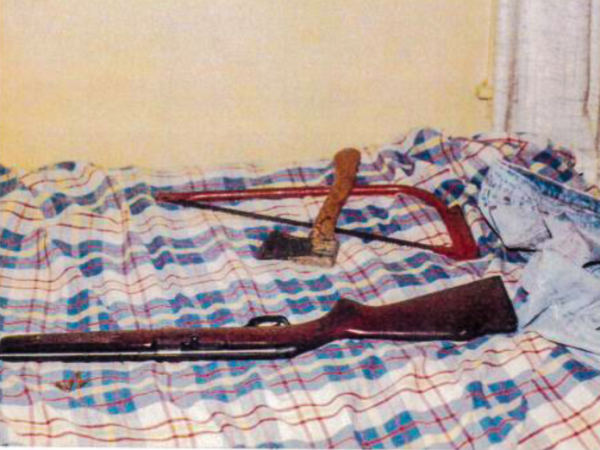 Weapons on a bed.