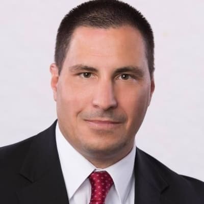 He's wearing a red tie.